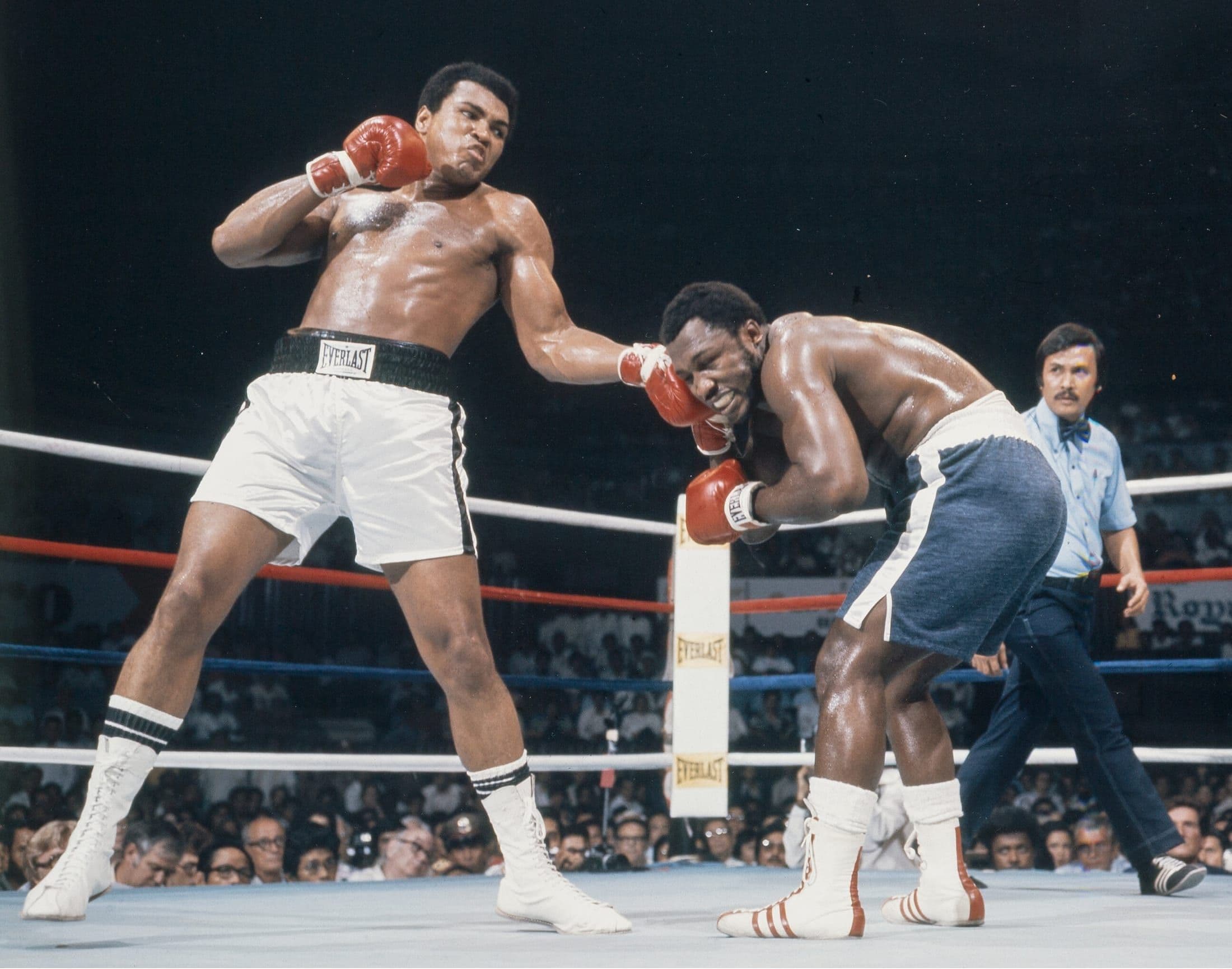 Muhammad Ali and Joe Frazier exchanging punches during the Thrilla in Manila