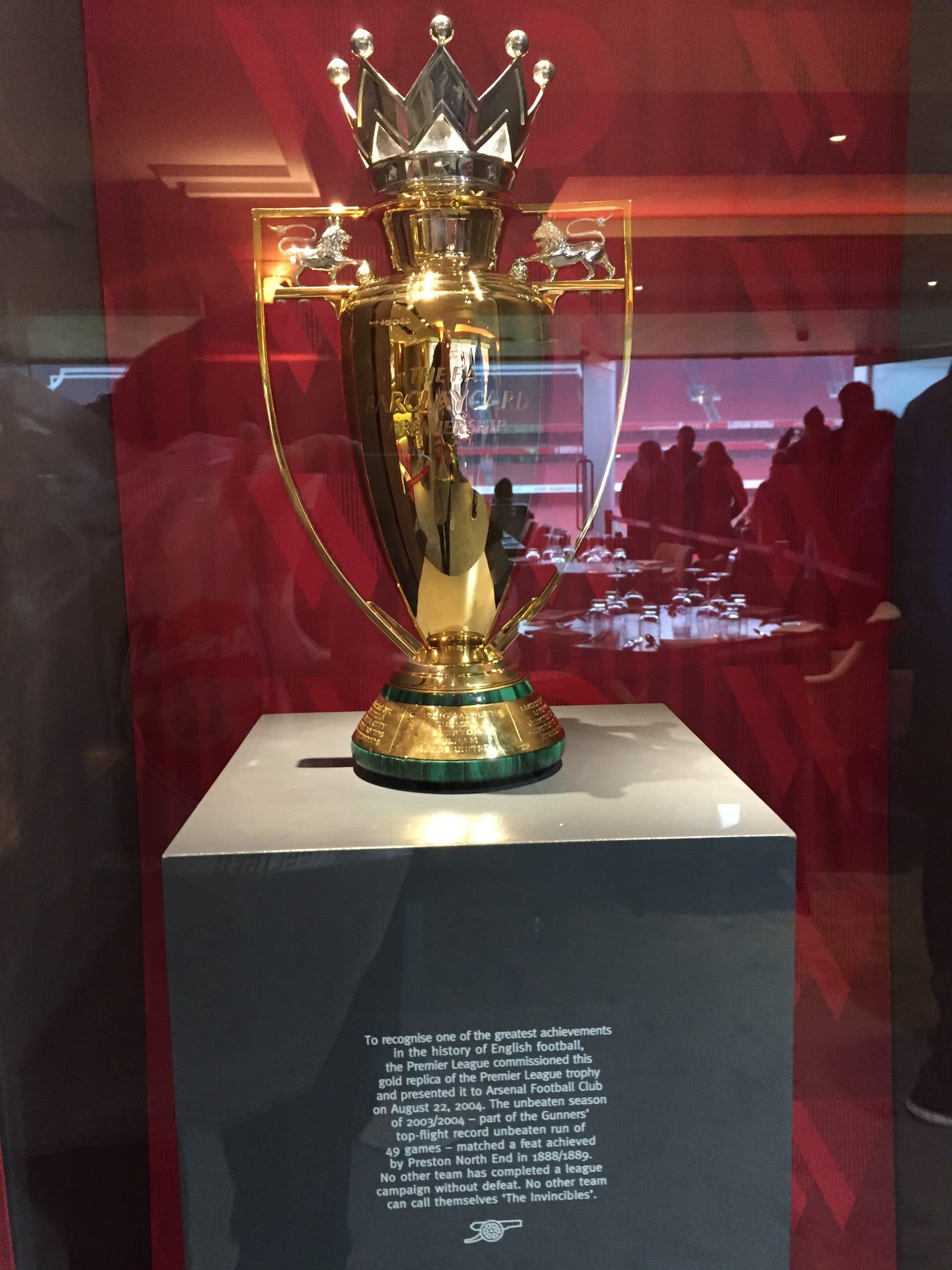 The gold Invincibles trophy commemorating Arsenal's unbeaten 2003/04 season, on display at Emirates Stadium